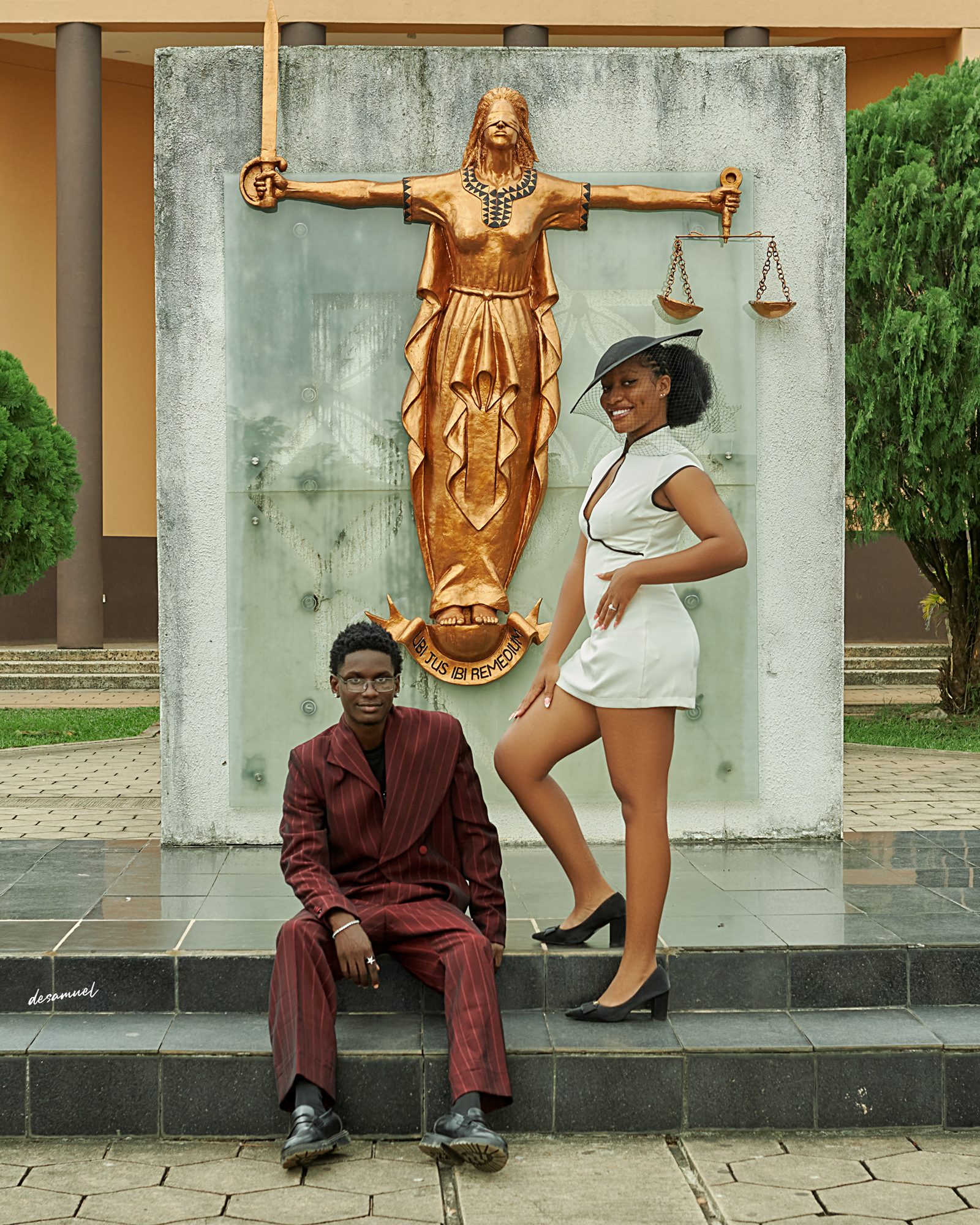 The couple before the Justice statue